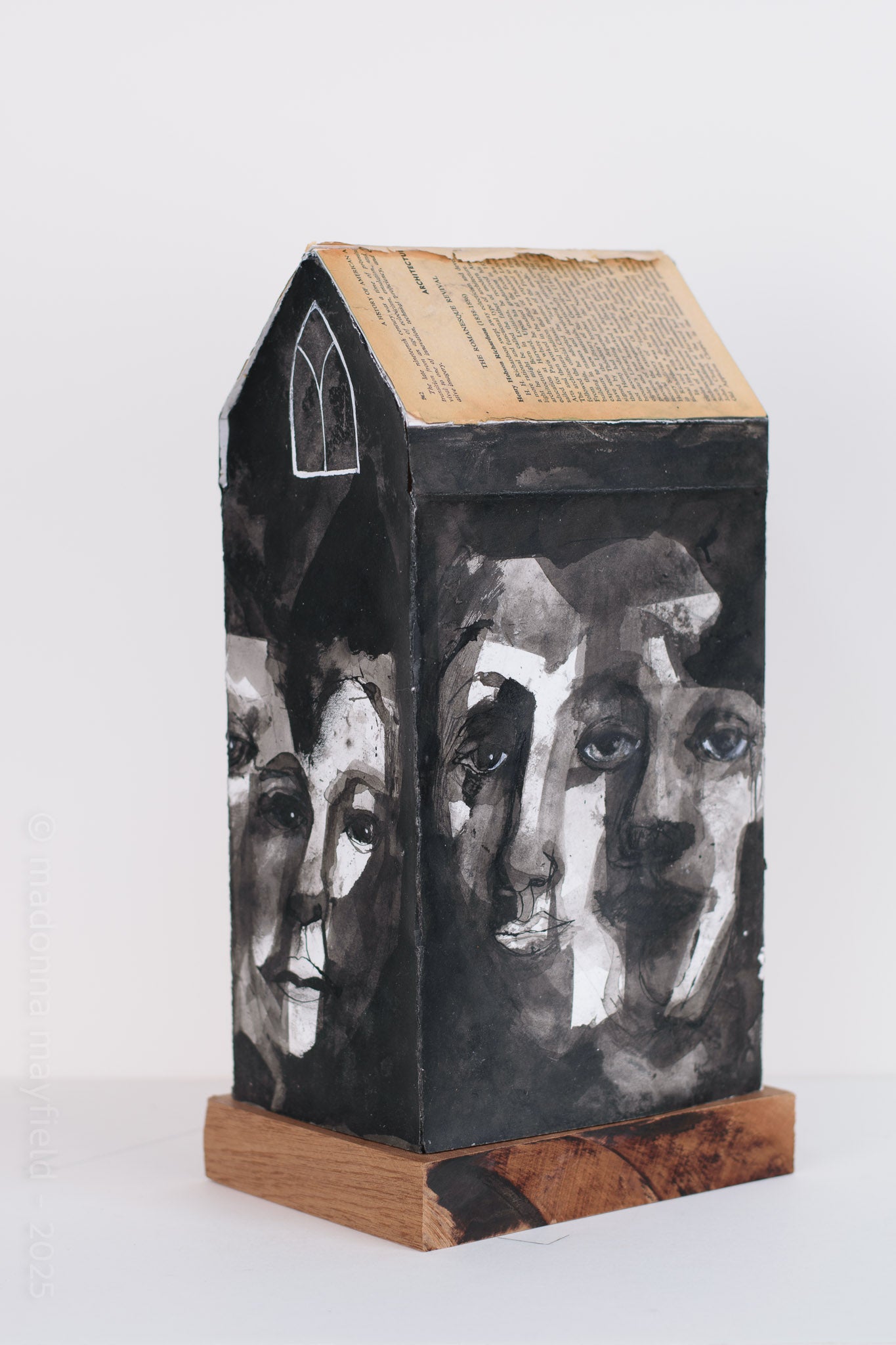 Decorative box with artistic faces on a white background